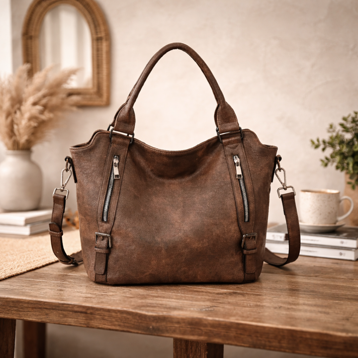 Hobo shoulder bag worn on model, side three-quarter view