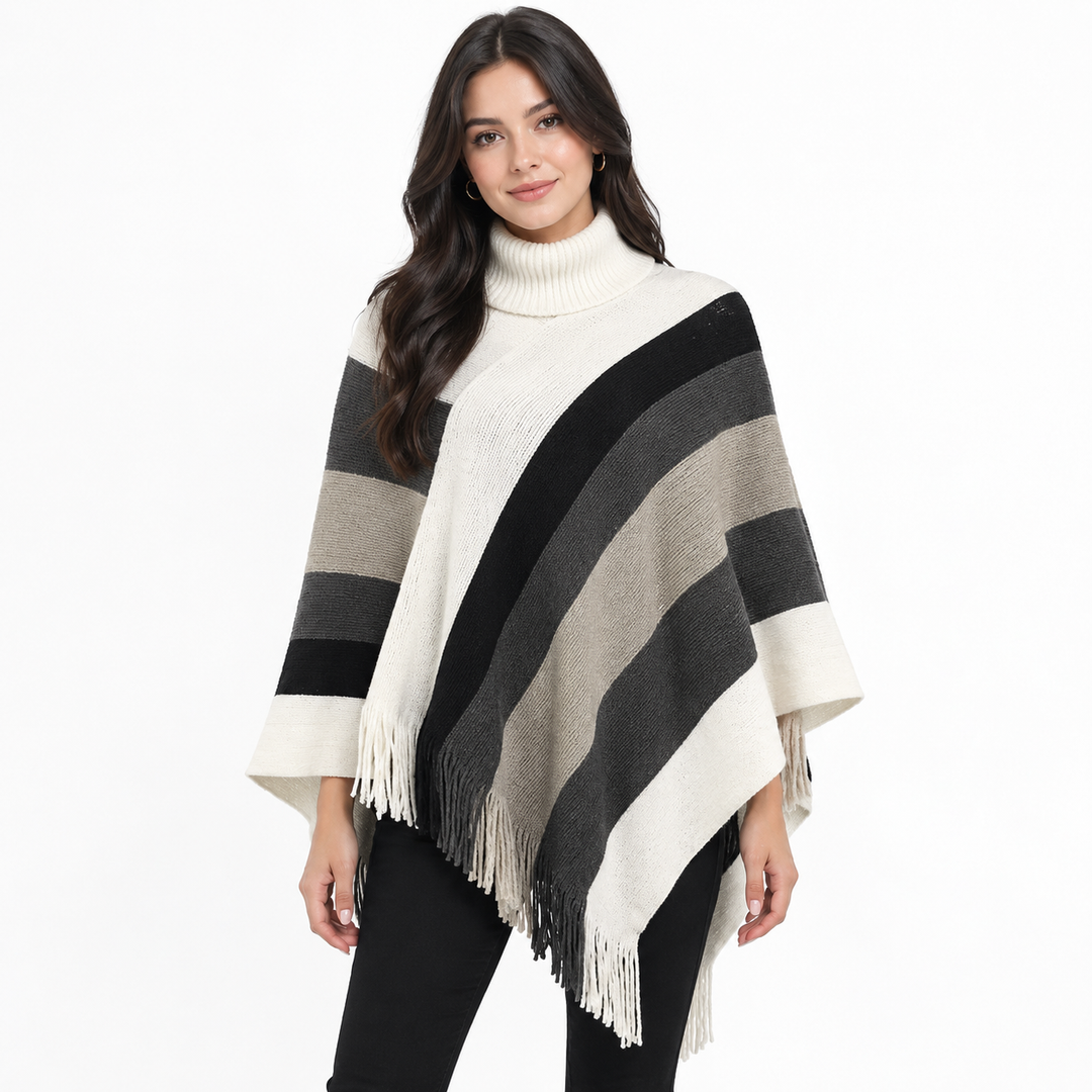 Oversized striped turtleneck poncho cape sweater with fringe tassel hem, front view