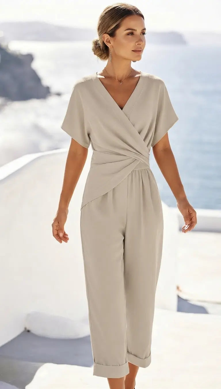 Women's light beige two-piece set with wrap-front top and cuffed tapered trousers, front view
