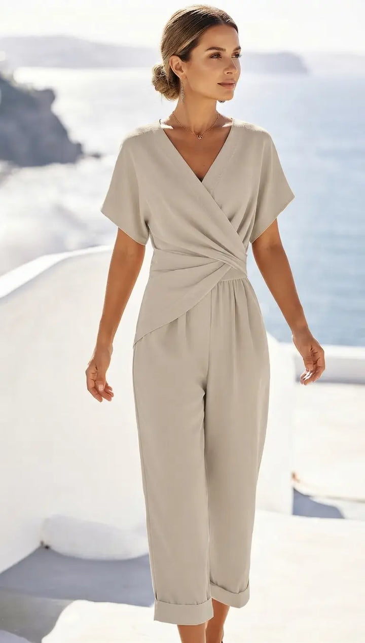 Women's light beige two-piece set with wrap-front top and cuffed tapered trousers, front view
