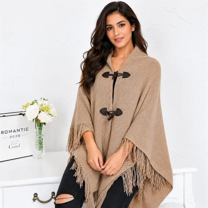 Women's tassel poncho cape with horn button closure, front view