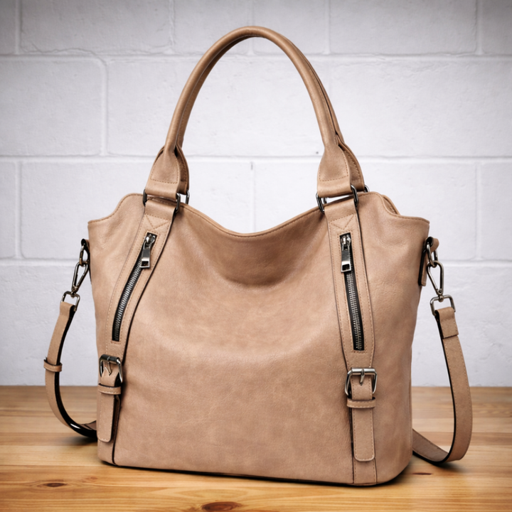 Hobo tote bag with looped top handle and adjustable shoulder strap, side view