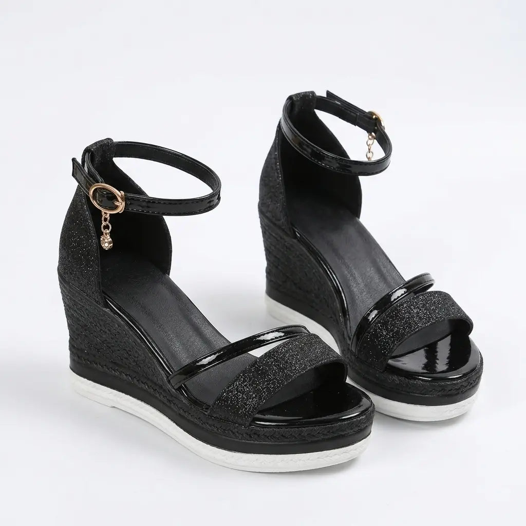 Black glitter wedge sandals with patent strap, ankle strap and braided espadrille wedge, angled pair view