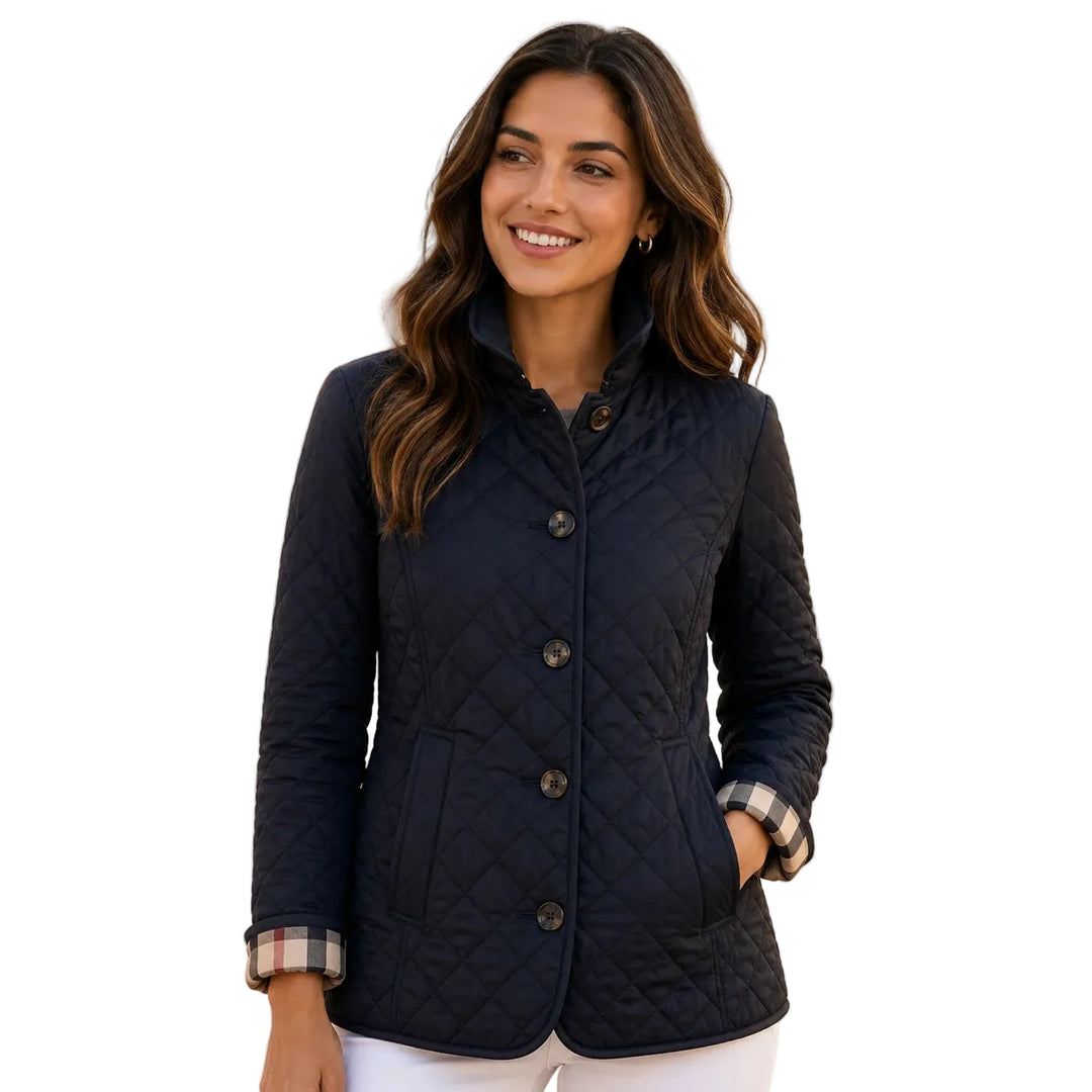 Slim-fit quilted short jacket with high collar, front view — navy blue