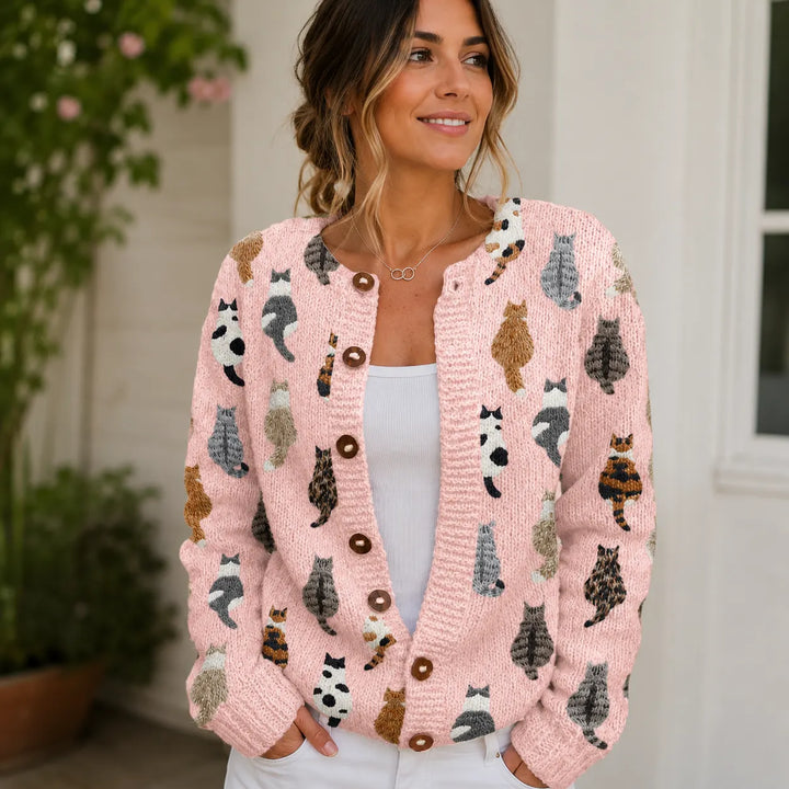 Pink cat print cardigan with round neckline and button closure, front view