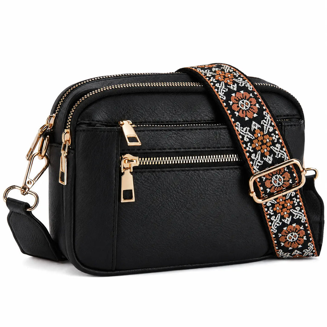 Camera crossbody bag with wide woven jacquard shoulder strap in geometric floral pattern