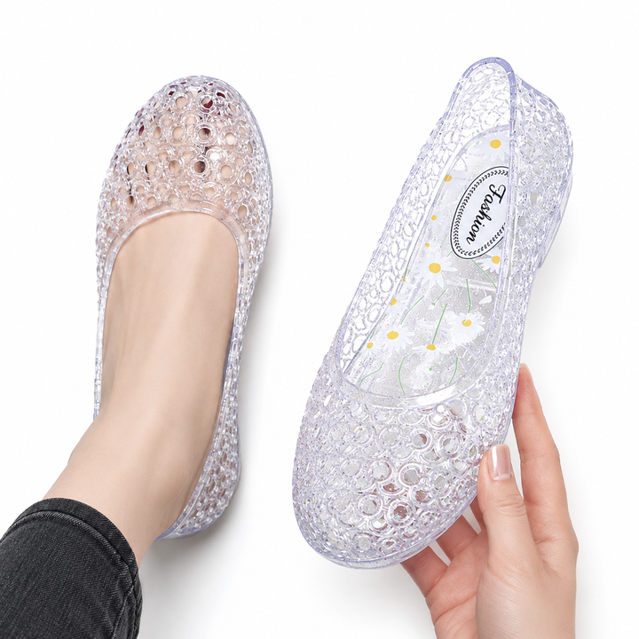 Women's silver jelly flat slip-on shoe with bubble cutout lattice pattern, flat-lay view