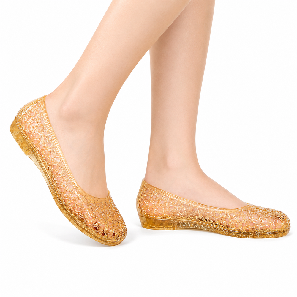 Women's gold jelly flat slip-on shoe with bubble cutout lattice pattern, flat-lay view