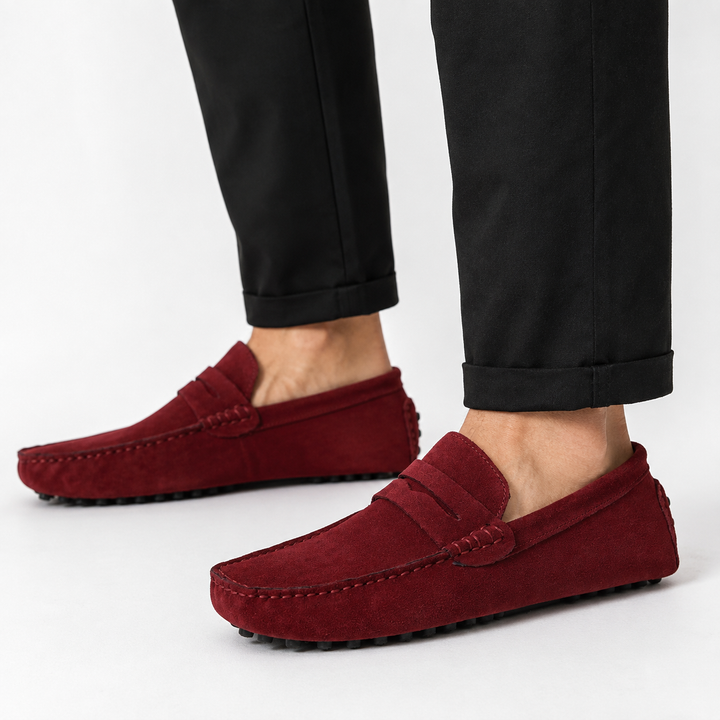 Close-up of penny keeper strap and moc toe stitching on suede loafer