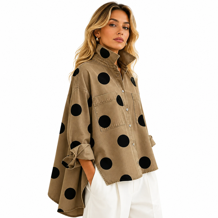 Women's polka dot button-up shirt showing high-low hemline, back view