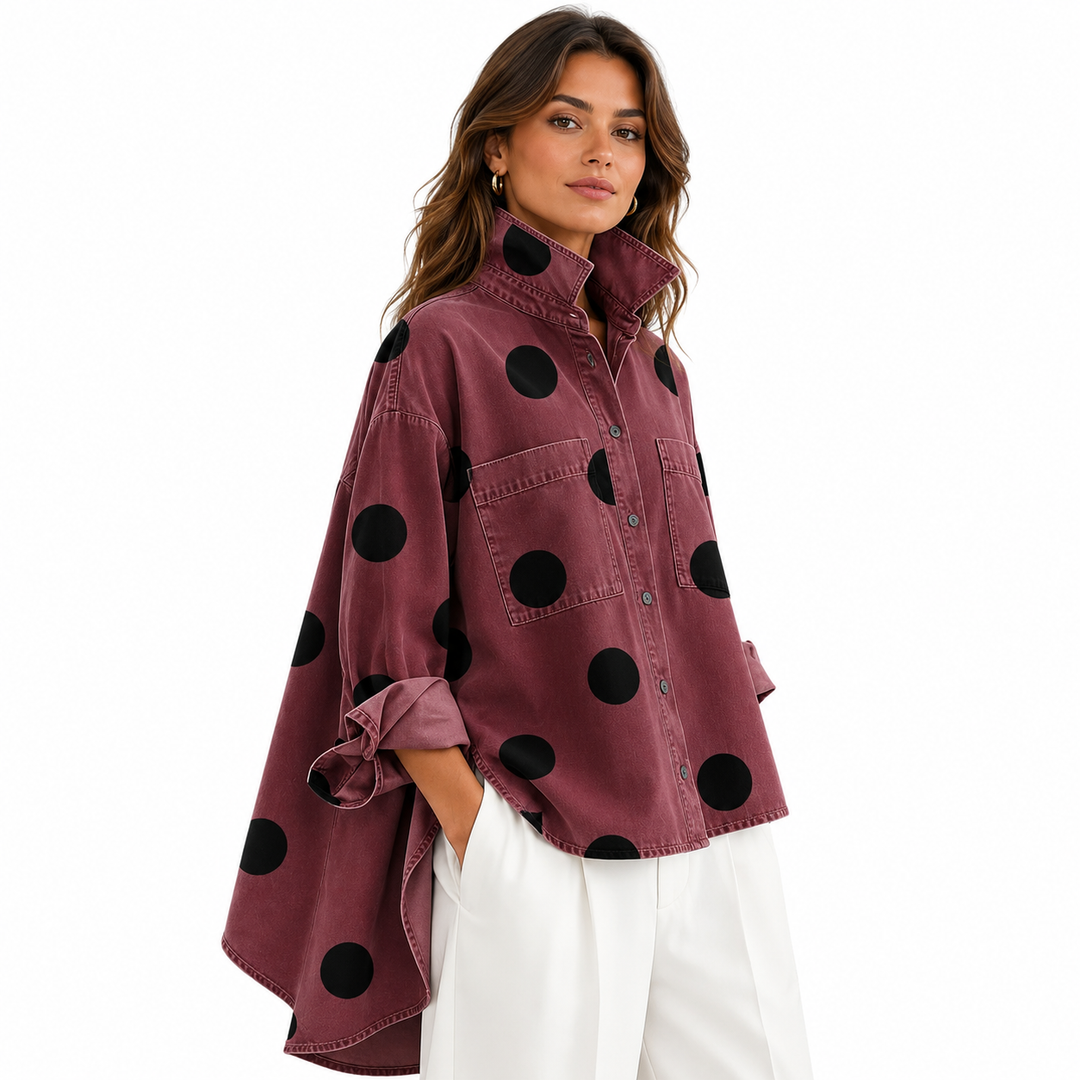 Polka dot button-up shirt with spread collar laid flat showing full design