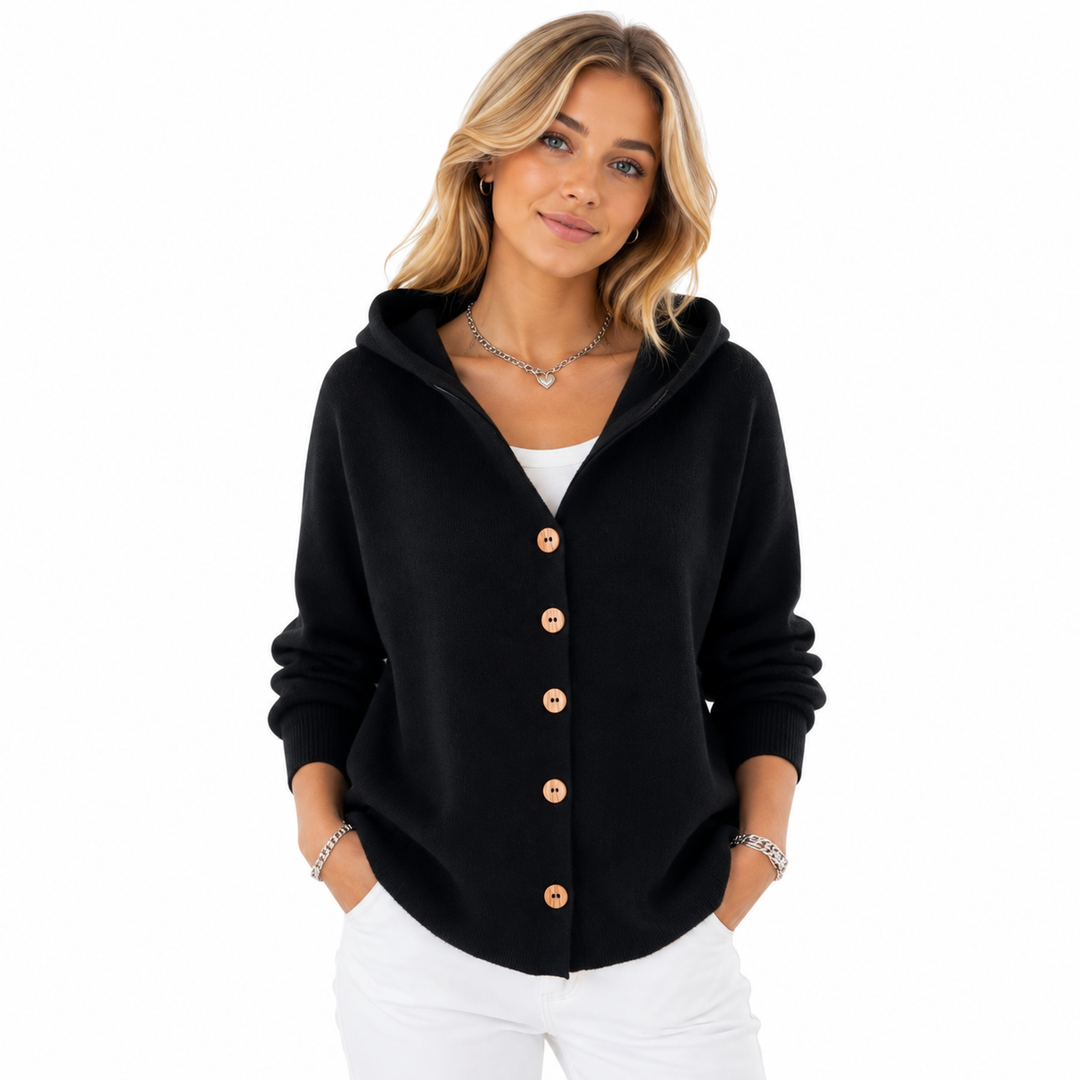 Close-up of wood-tone buttons and ribbed cuff detail on hooded cardigan