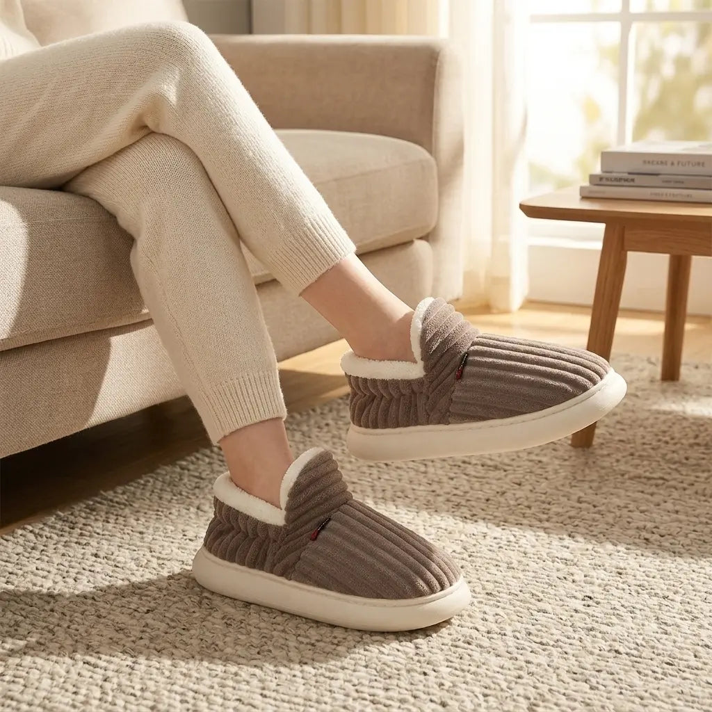 Ribbed corduroy house slippers in taupe with cream sherpa lining, lifestyle front view