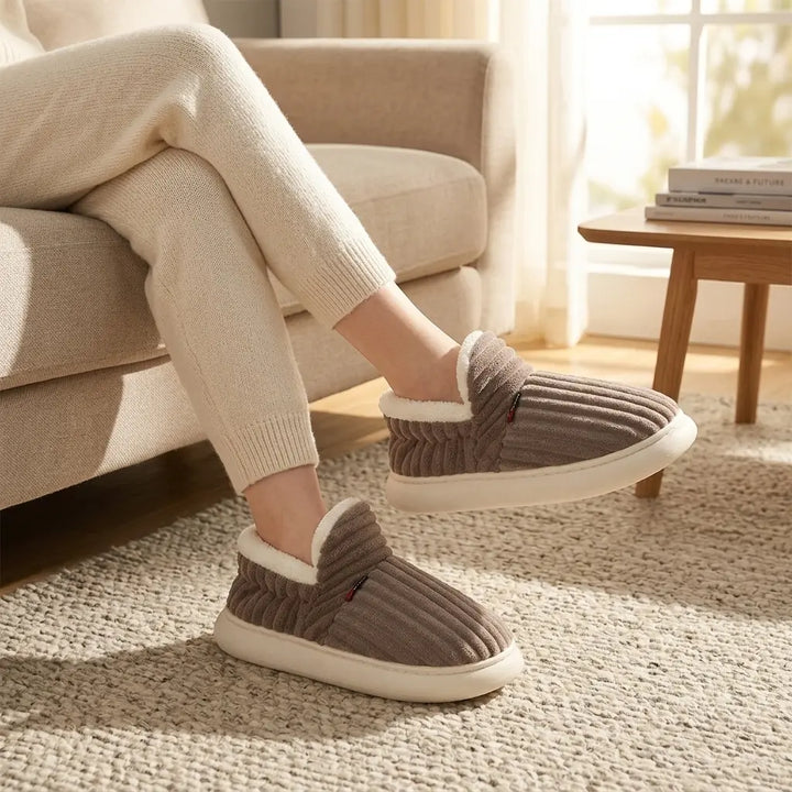 Ribbed corduroy house slippers in taupe with cream sherpa lining, lifestyle front view
