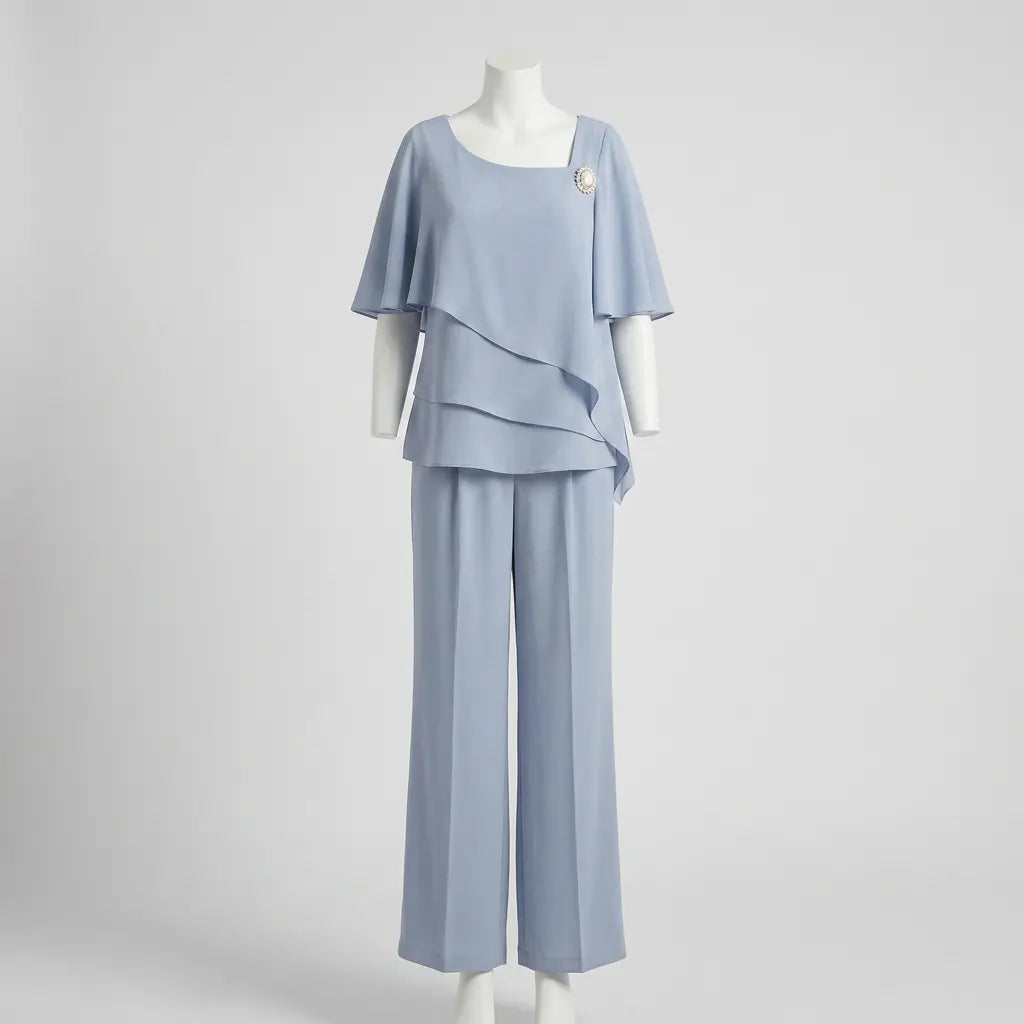 Light blue asymmetric layered top and straight-leg trousers on mannequin, front view