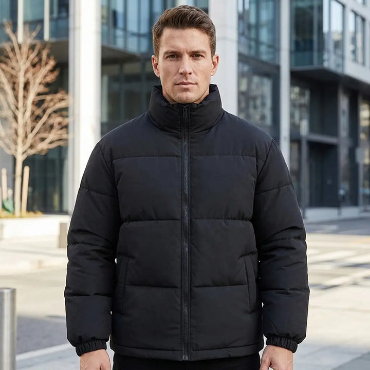 Men's quilted puffer jacket in black, stand collar and zip, side pockets visible