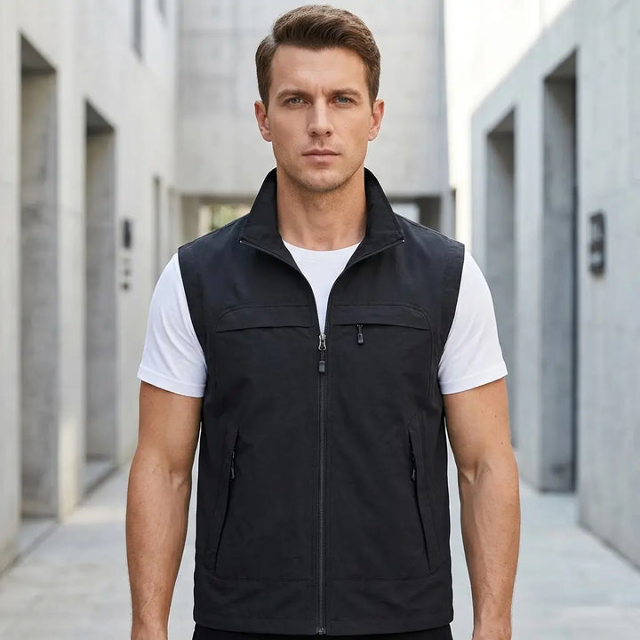Men's utility vest in black with chest pockets and full-length zip, front view