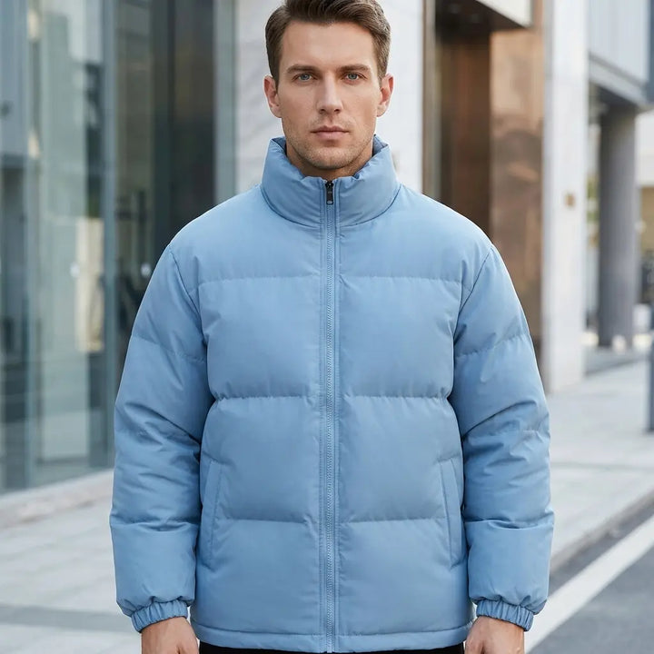 Men's quilted puffer jacket in light blue, stand collar and zip, front view
