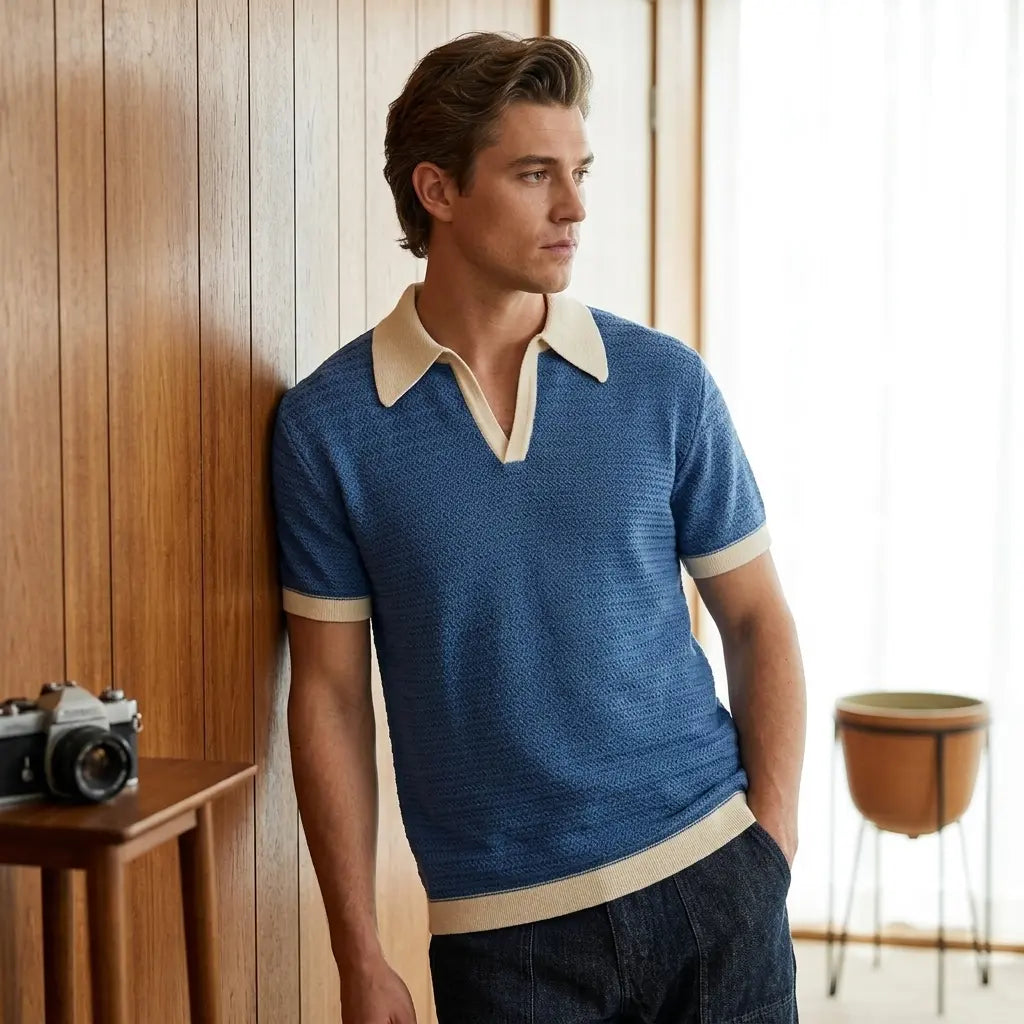 Men's retro knit polo shirt with wide 70s collar, short sleeves, navy blue, front view