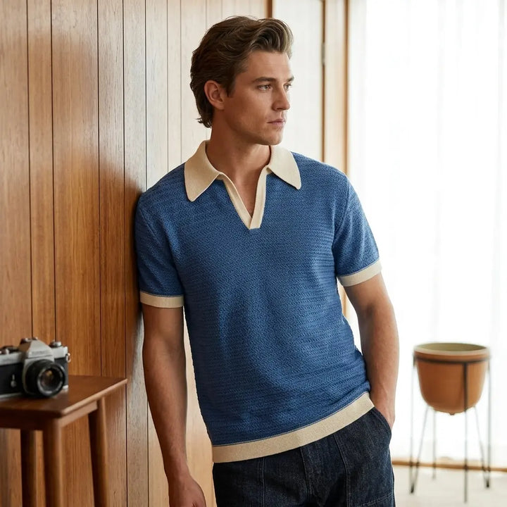 Men's retro knit polo shirt with wide 70s collar, short sleeves, navy blue, front view