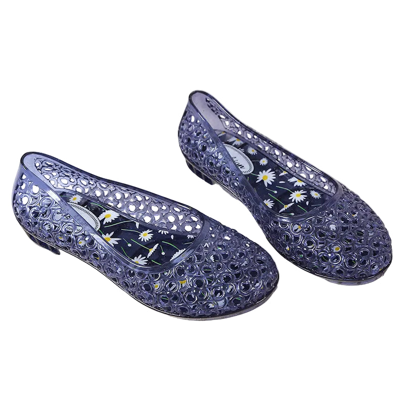 Jelly slip-on shoes with floral cutout pattern and daisy-print insole, detail view