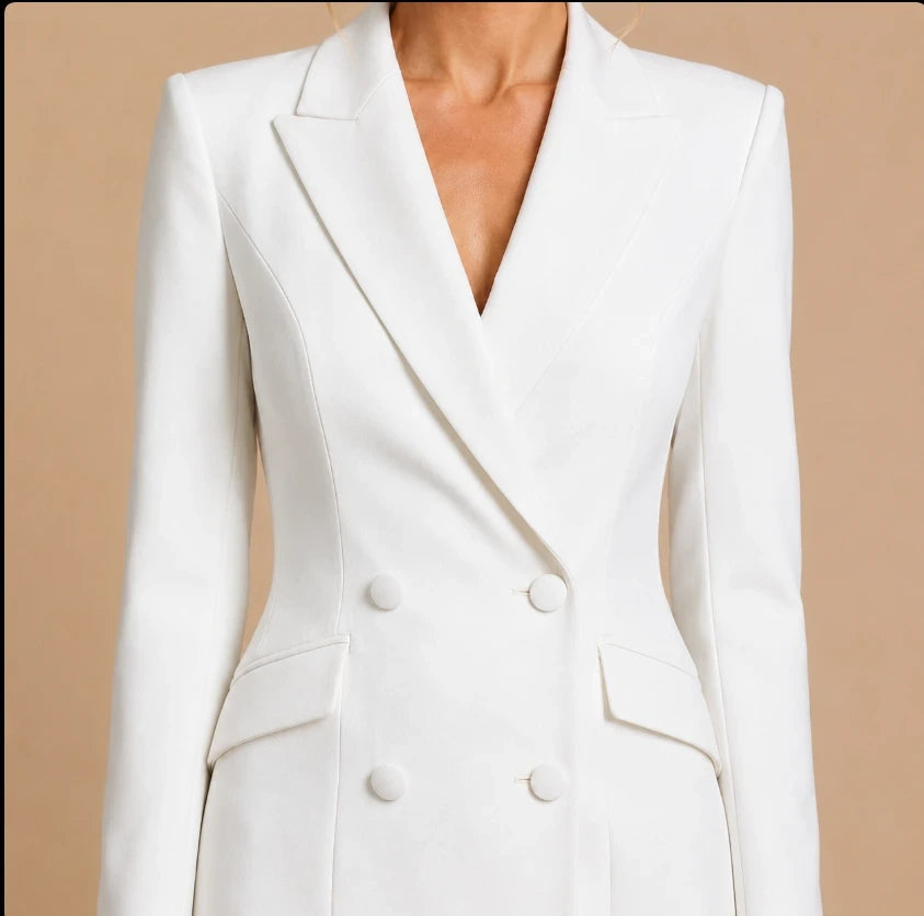 Double-breasted blazer dress close-up with notched lapels and flap pockets