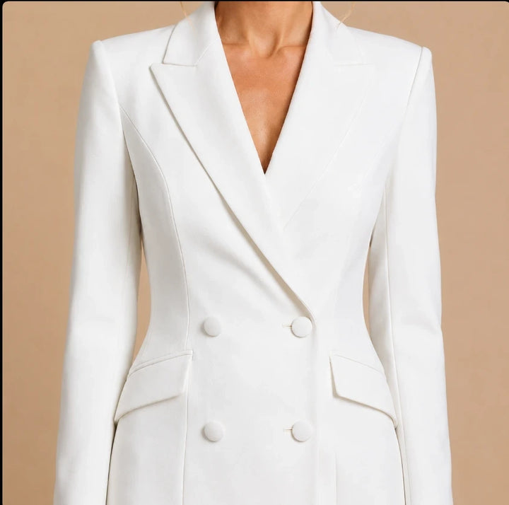 Double-breasted blazer dress close-up with notched lapels and flap pockets