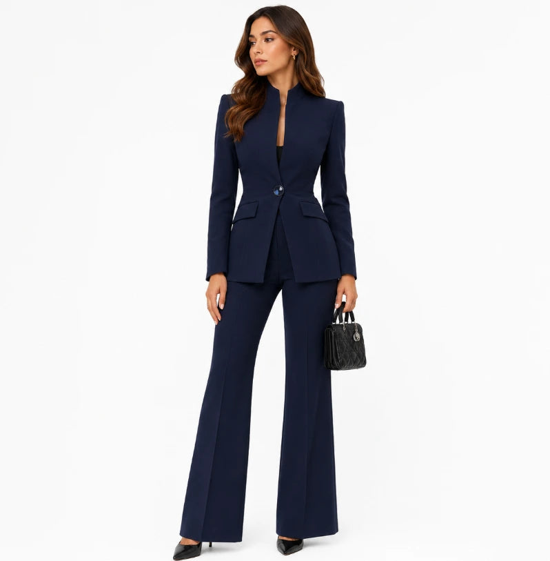 Stand-collar blazer with single statement button and flap pockets, tapered waist