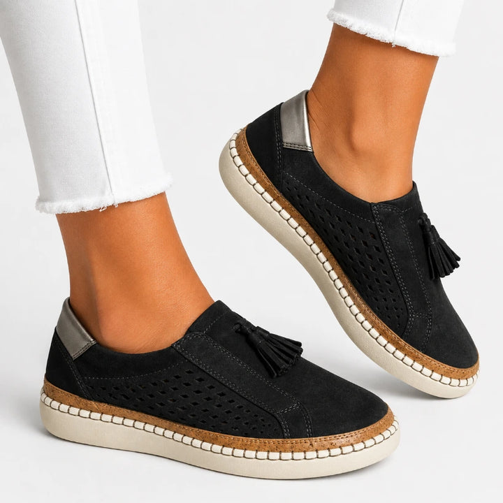 Women's orthopedic slip-on shoe with metallic heel accent for everyday casual wear