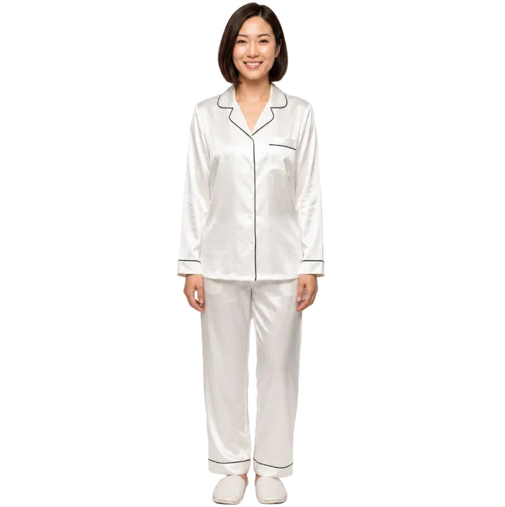 Satin-look two-piece pajama set with black piping, long-sleeve button top and straight-leg pants, white, front view