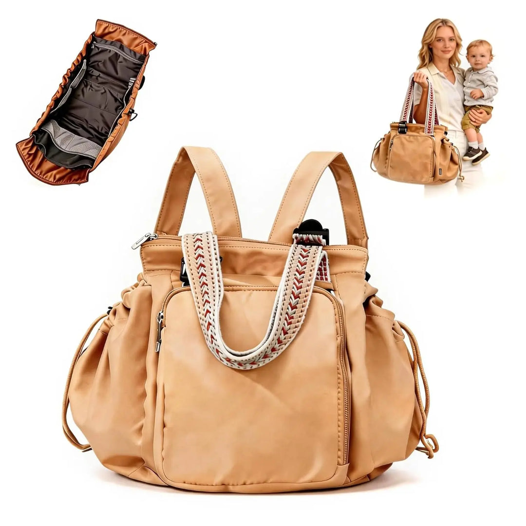 Tan convertible diaper tote with woven handles, shown front on with a lay-flat interior inset
