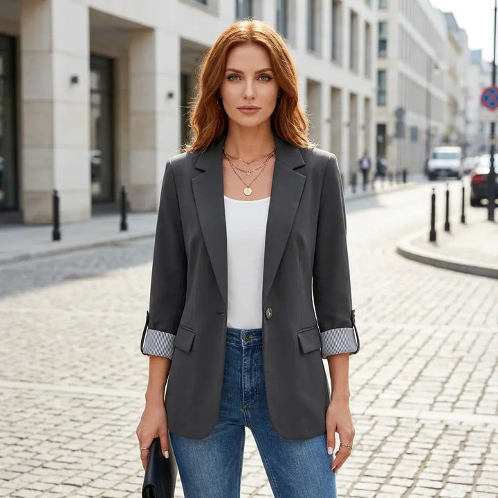 Women's lightweight blazer styled casually with jeans — hip-length regular fit silhouette
