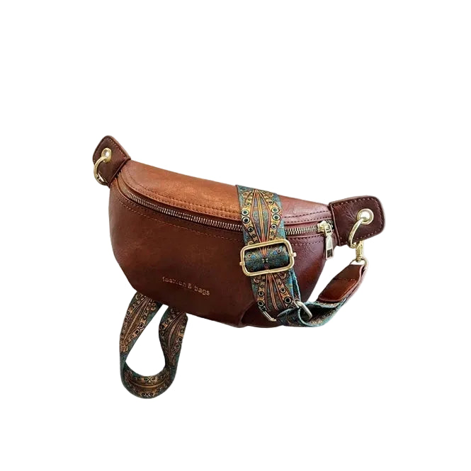Brown leather belt bag with embroidered strap and gold hardware, flat lay