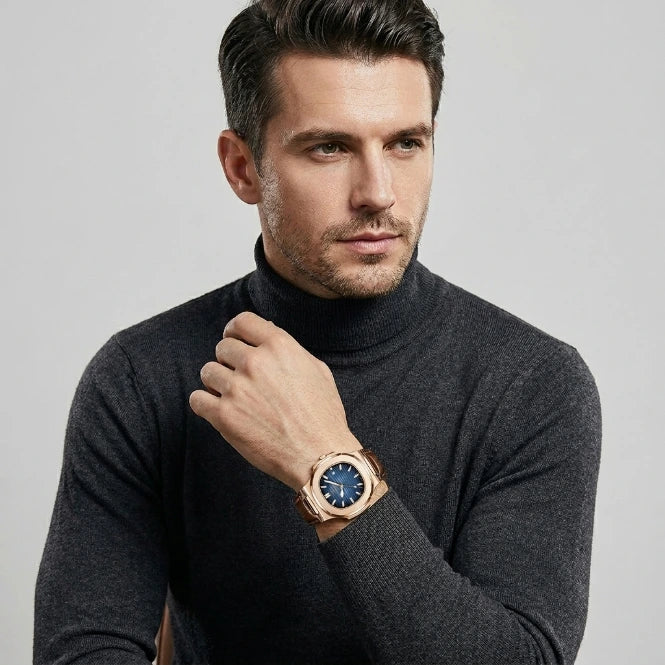 Men's luxury analog wristwatch blue dial rose gold case detail view