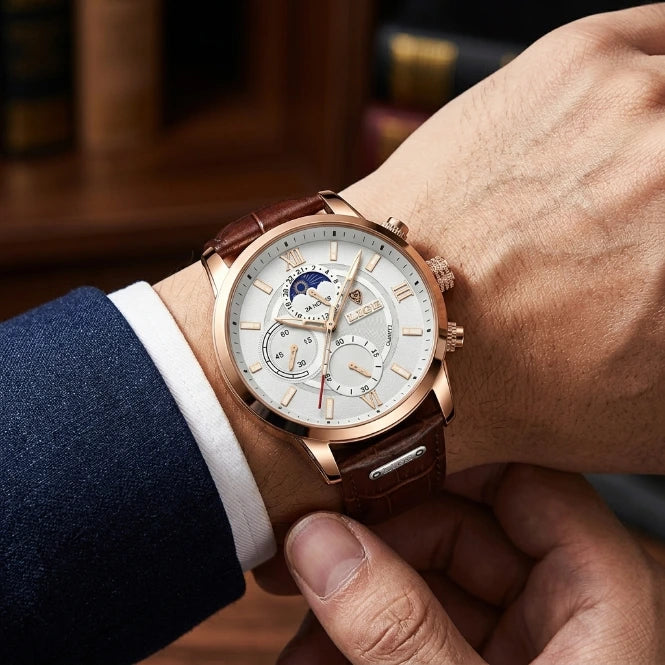 Men's quartz chronograph wristwatch with brown leather strap worn with suit