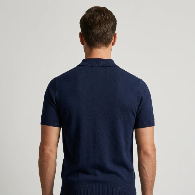 Men's knit polo shirt back view in solid navy
