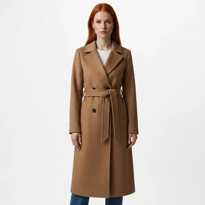 Women's long double-breasted belted coat in camel, front view on model