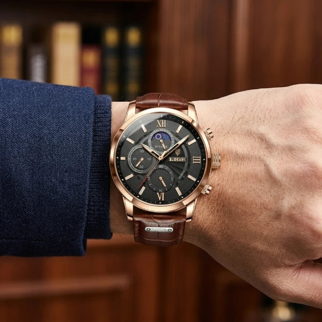 Men's moon phase chronograph watch flat lay, rose gold case with white dial