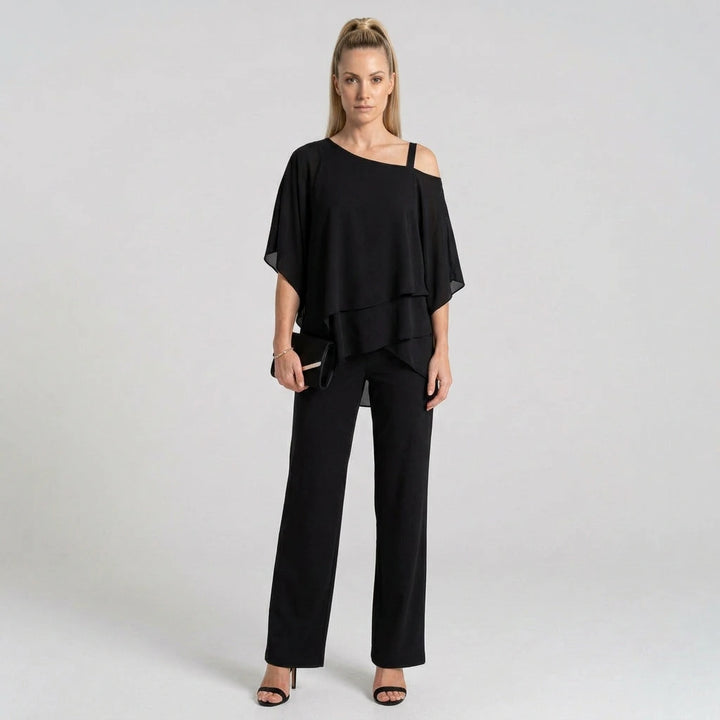 Women's black chiffon layered top and wide-leg pants set, model front view