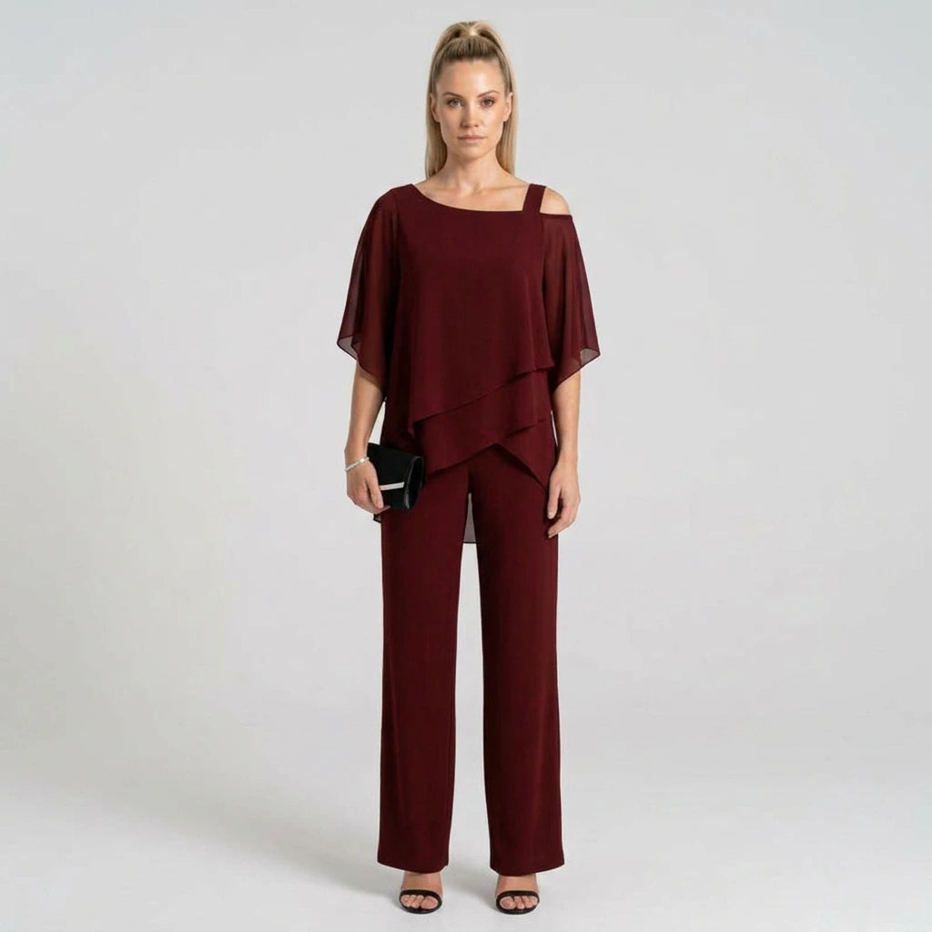 Women's burgundy chiffon layered top and wide-leg pants set, model front view