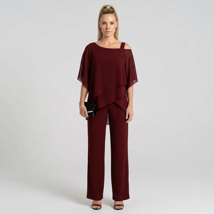 Women's burgundy chiffon layered top and wide-leg pants set, model front view