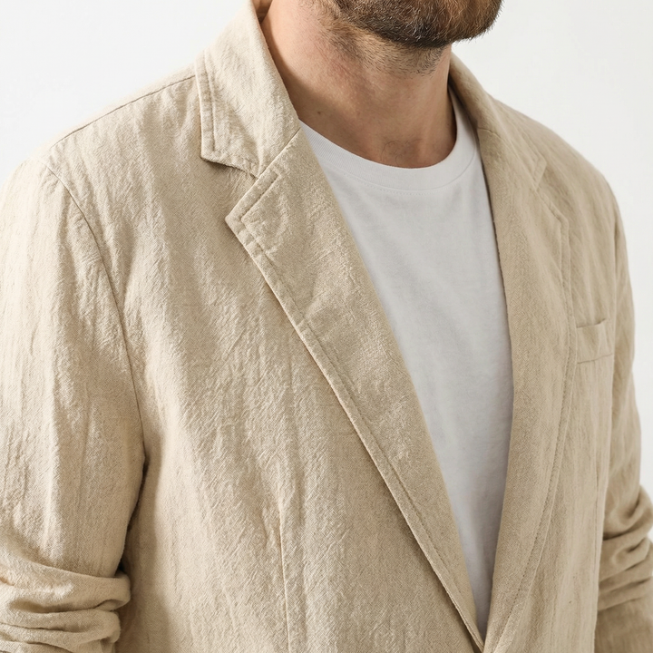 Men's linen blazer in khaki, front view showing button placket and notched collar