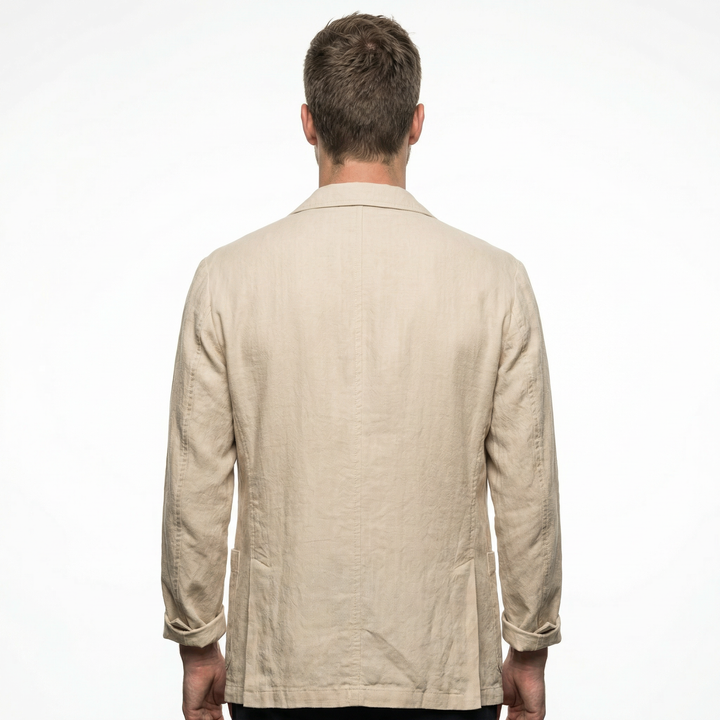 Close-up of linen fabric texture and button detail on men's blazer