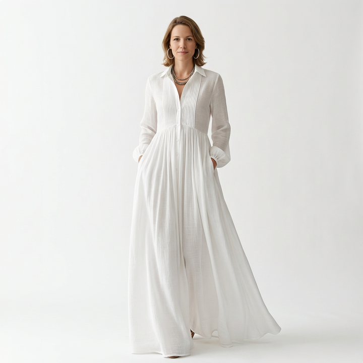 White maxi dress with shirt collar, pintuck bodice and flowing A-line skirt, front view