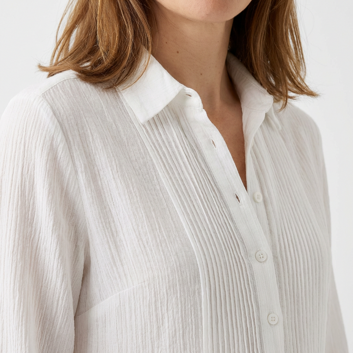 White maxi dress detail — shirt collar, pintuck pleating and button front close-up