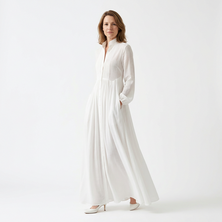 White maxi dress with stand collar and pintuck pleating, three-quarter view