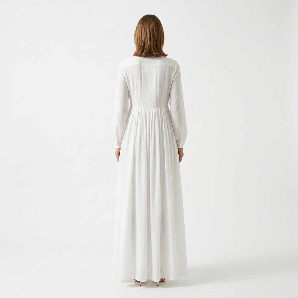 White maxi dress back view with pintuck bodice and flowing A-line skirt