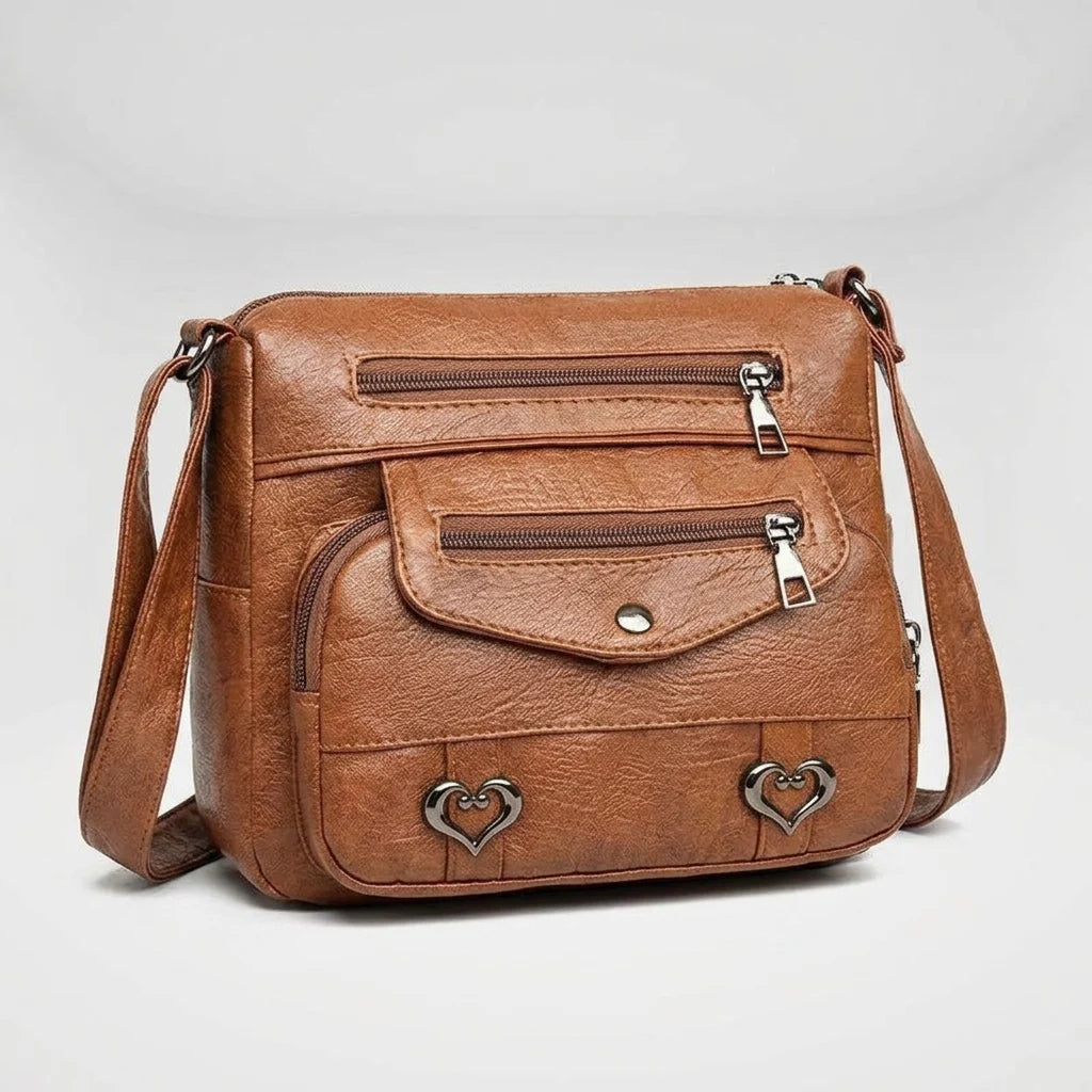 Women's structured shoulder bag in brown with gold hardware, front view