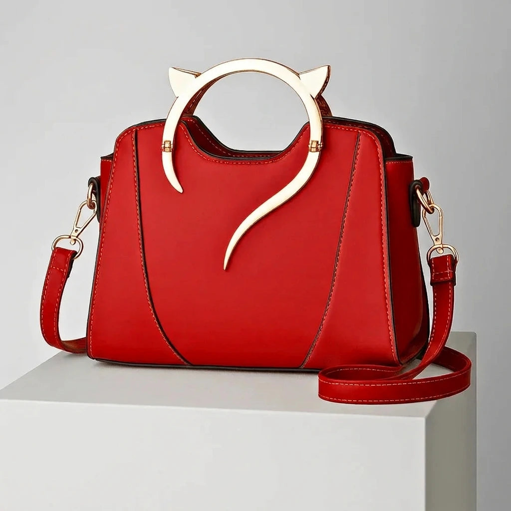 Structured black handbag with cat-ear ring handle — front studio shot, PU exterior
