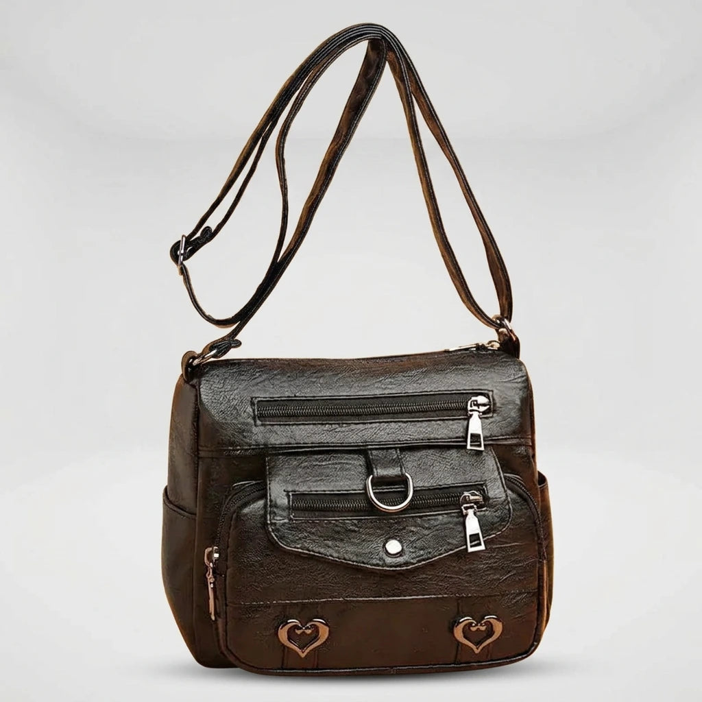 Women's structured shoulder bag in black with gold hardware, front view